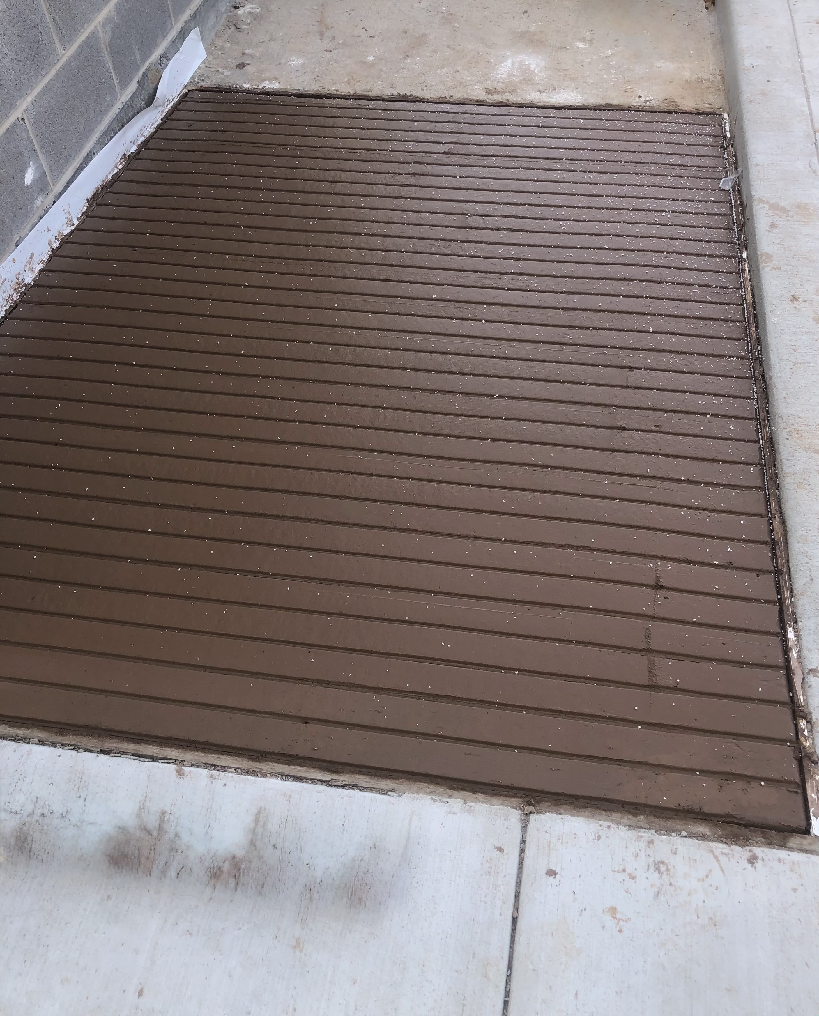 Colored stained concrete with linear pattern