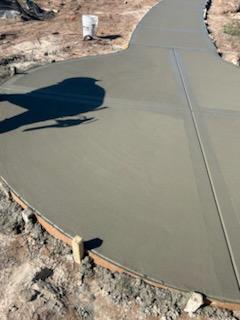 Curved concrete driveway fresh pour
